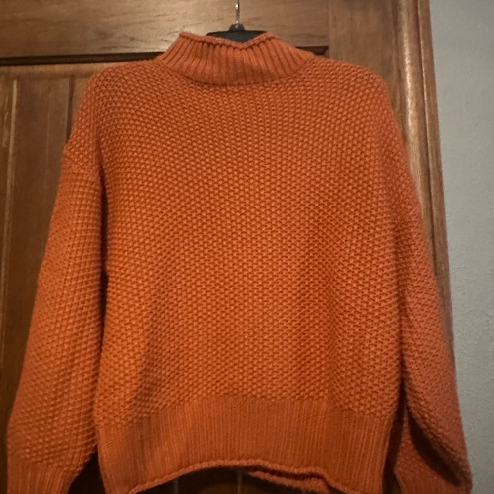 Size Small “Brick Red (more burnt orange) mock neck sweater. BNWOT. $17.00